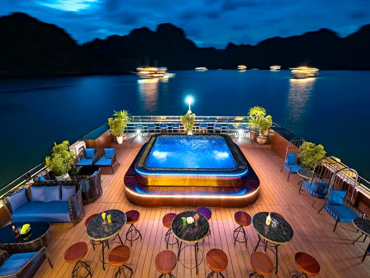 Lan Ha Bay cruise sundeck with illuminated pool at night